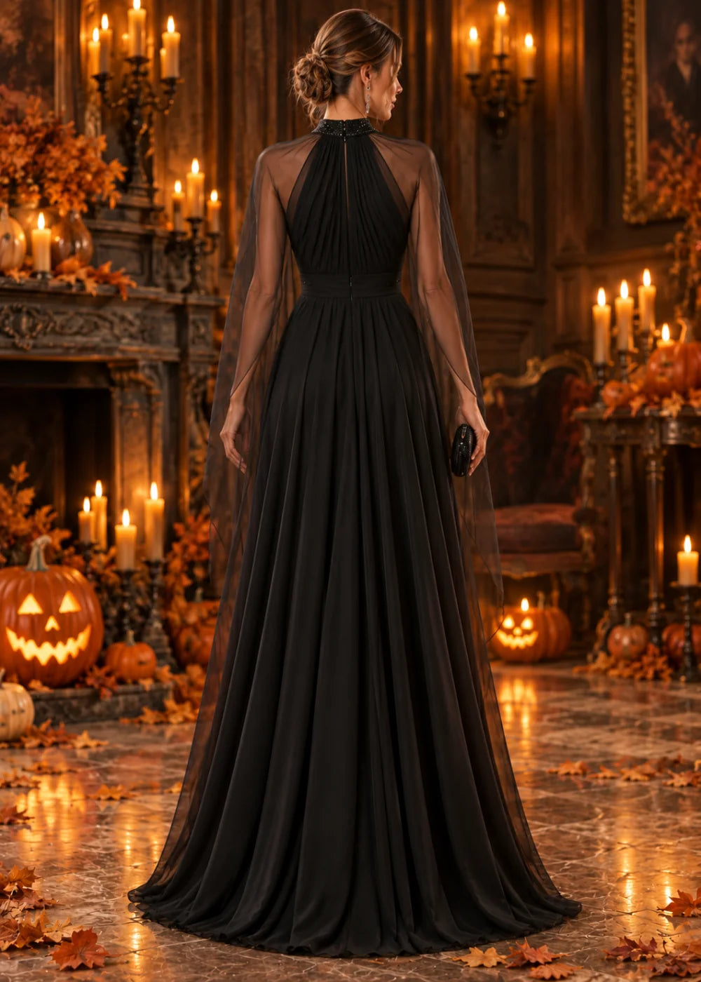 Back view showing the gathered high panel, sheer cape layer and ruched waist of the black gown.