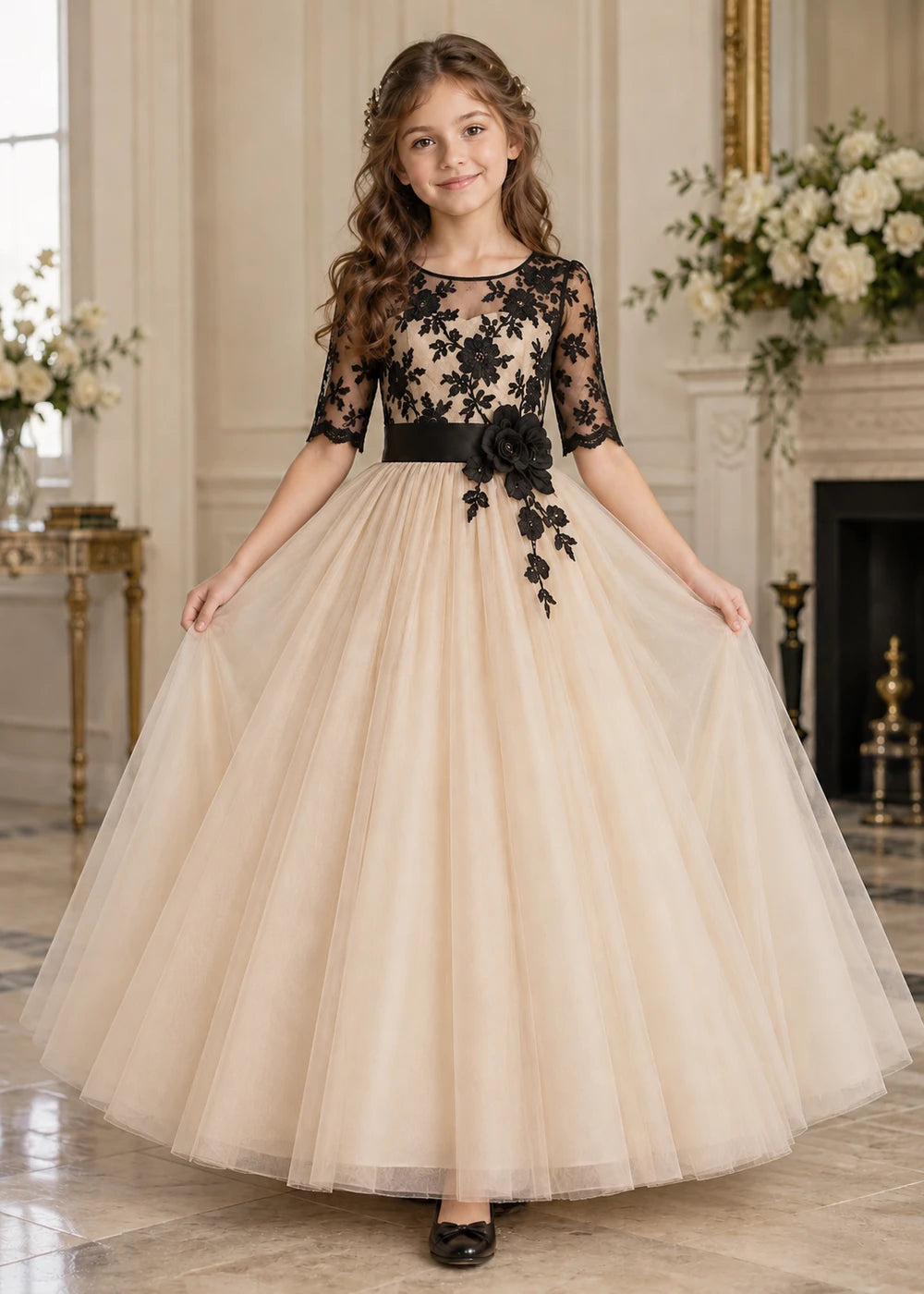 Detail view of the beige and black flower girl dress.