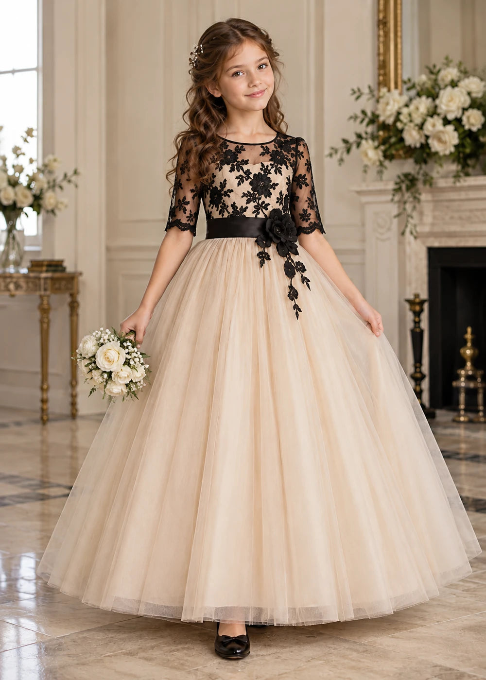 Detail view of the beige and black flower girl dress.