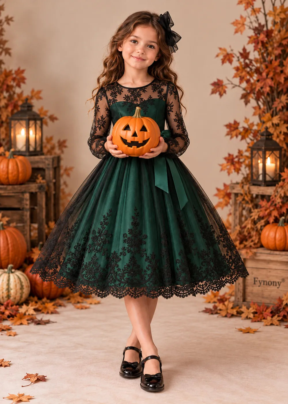 Detail view of the dark green and black flower girl dress.