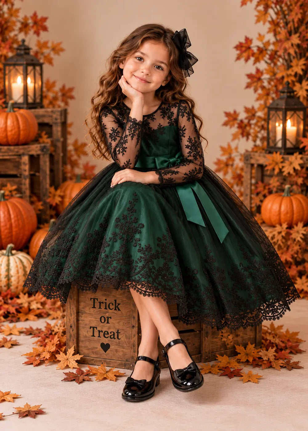 Detail view of the dark green and black flower girl dress.