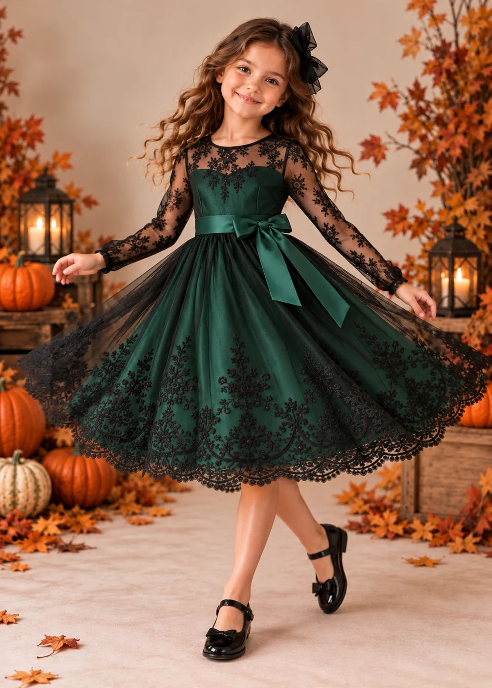 Detail view of the dark green and black flower girl dress.