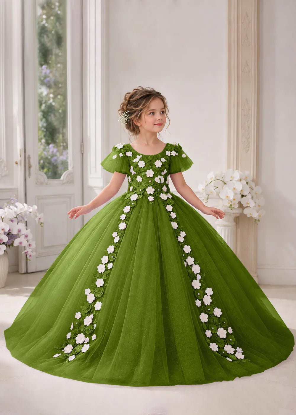 Front view of a child wearing a olive flower girl dress with a round neckline, sheer flutter cap sleeves and a floral vine cascading down both sides of a full tulle skirt.