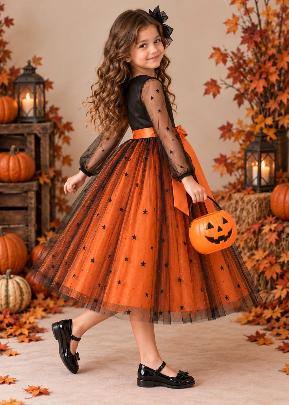 Detail view of the orange and black flower girl dress.