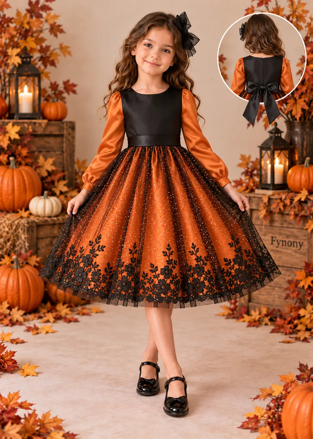 Detail view of the orange and black flower girl dress.