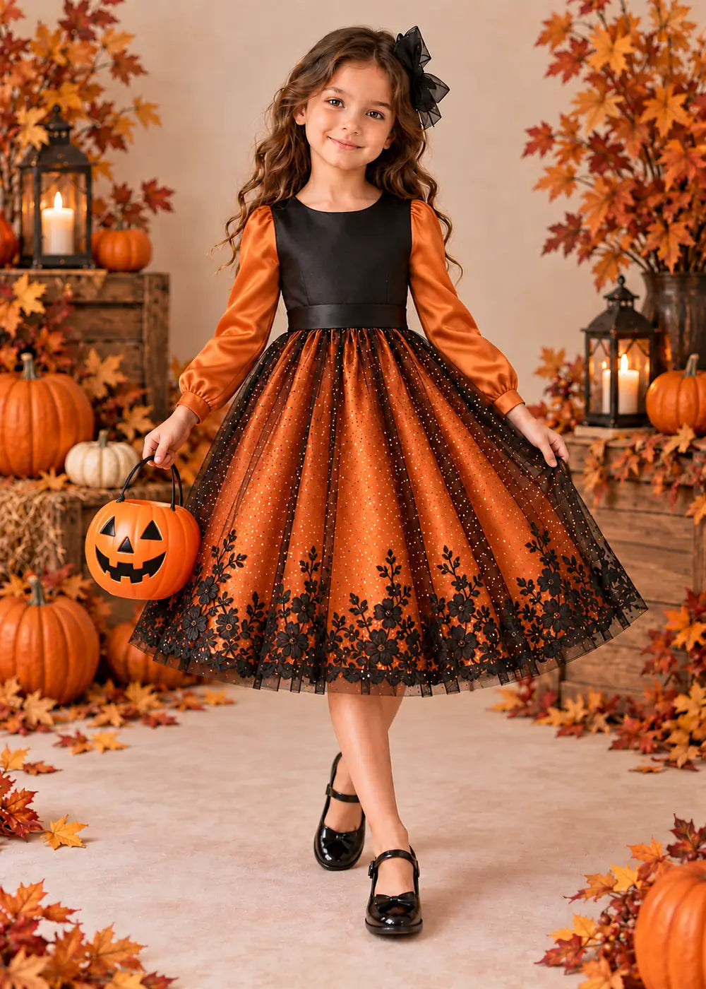 Detail view of the orange and black flower girl dress.