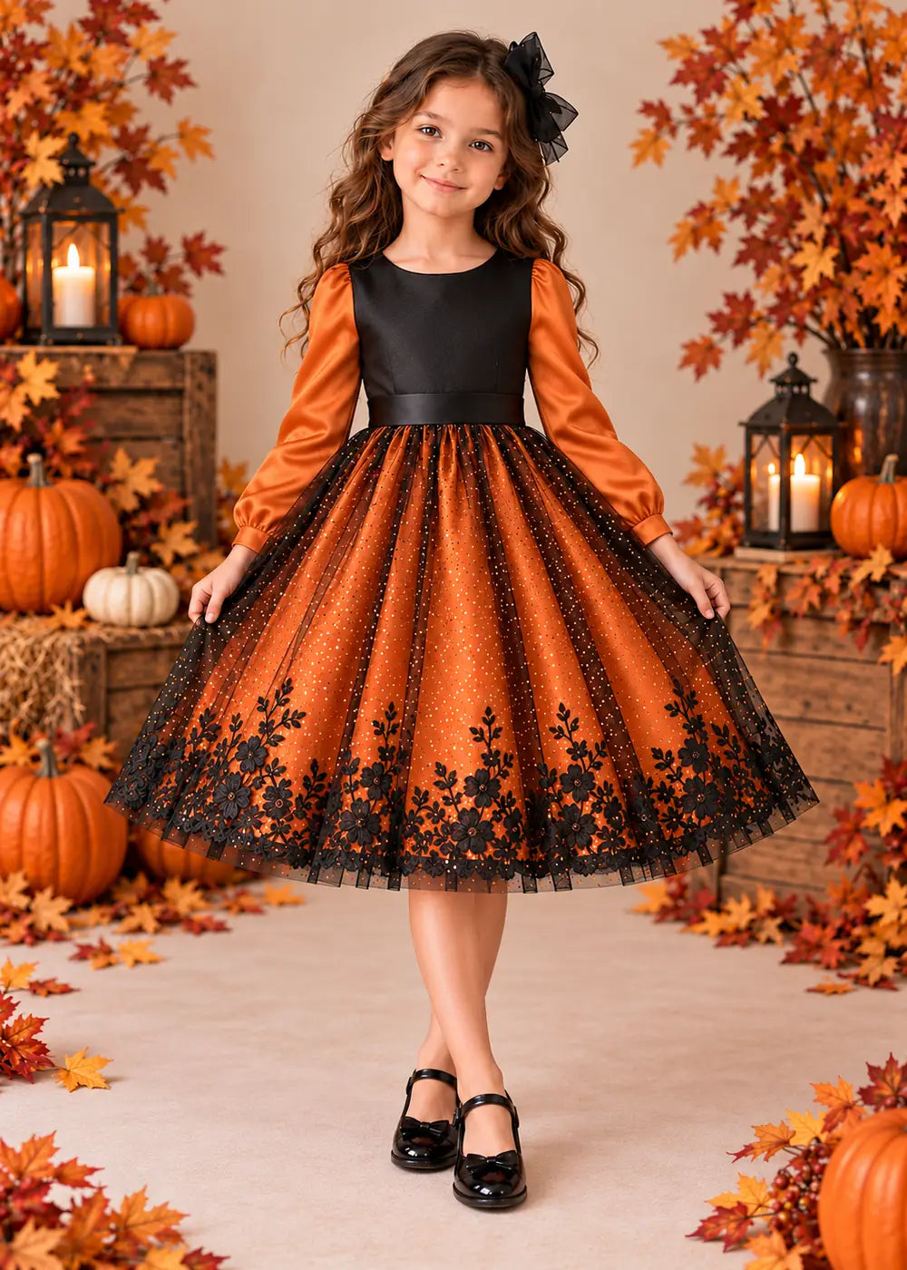 Front view of the orange and black flower girl dress.