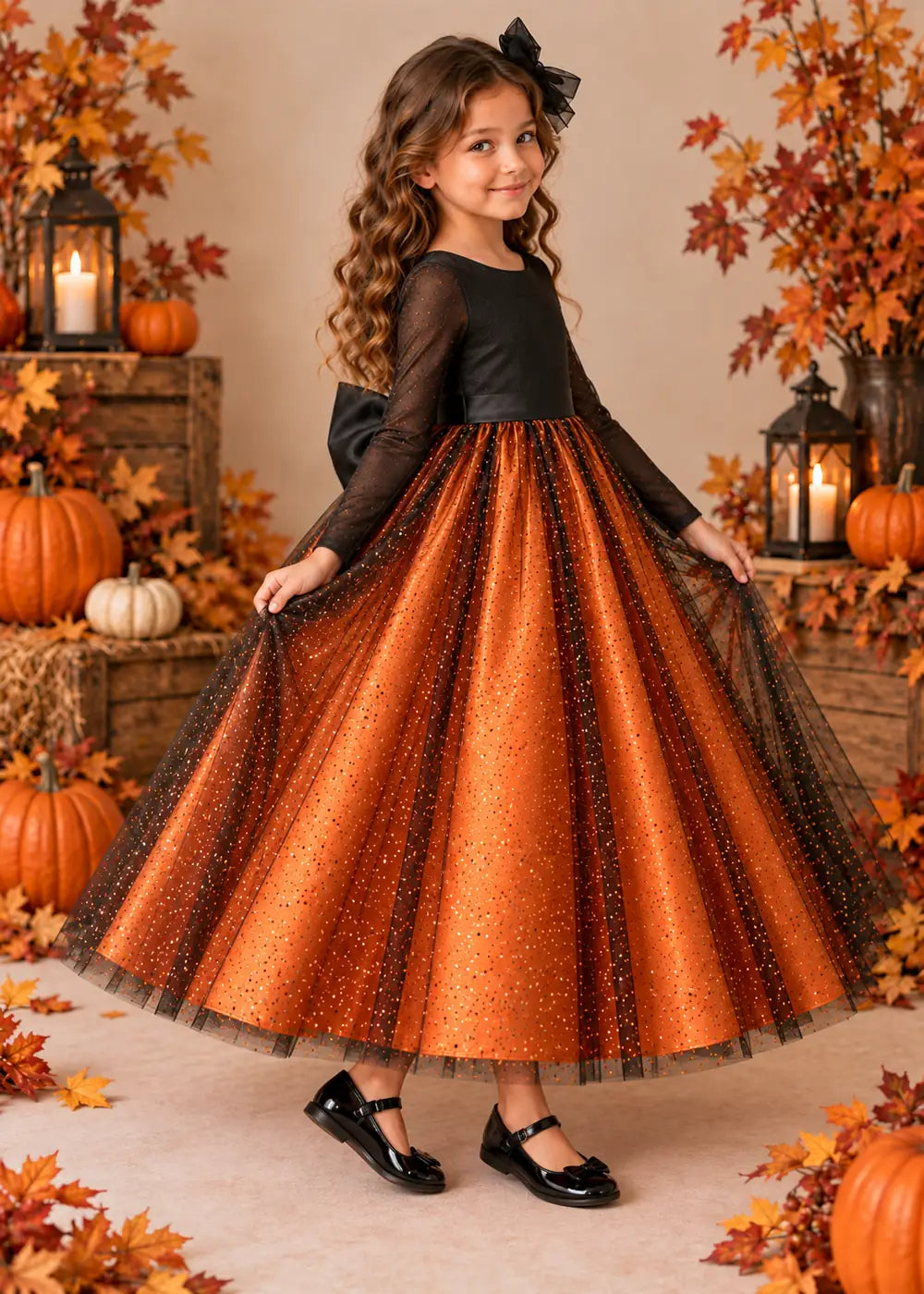 Detail view of the orange and black flower girl dress.