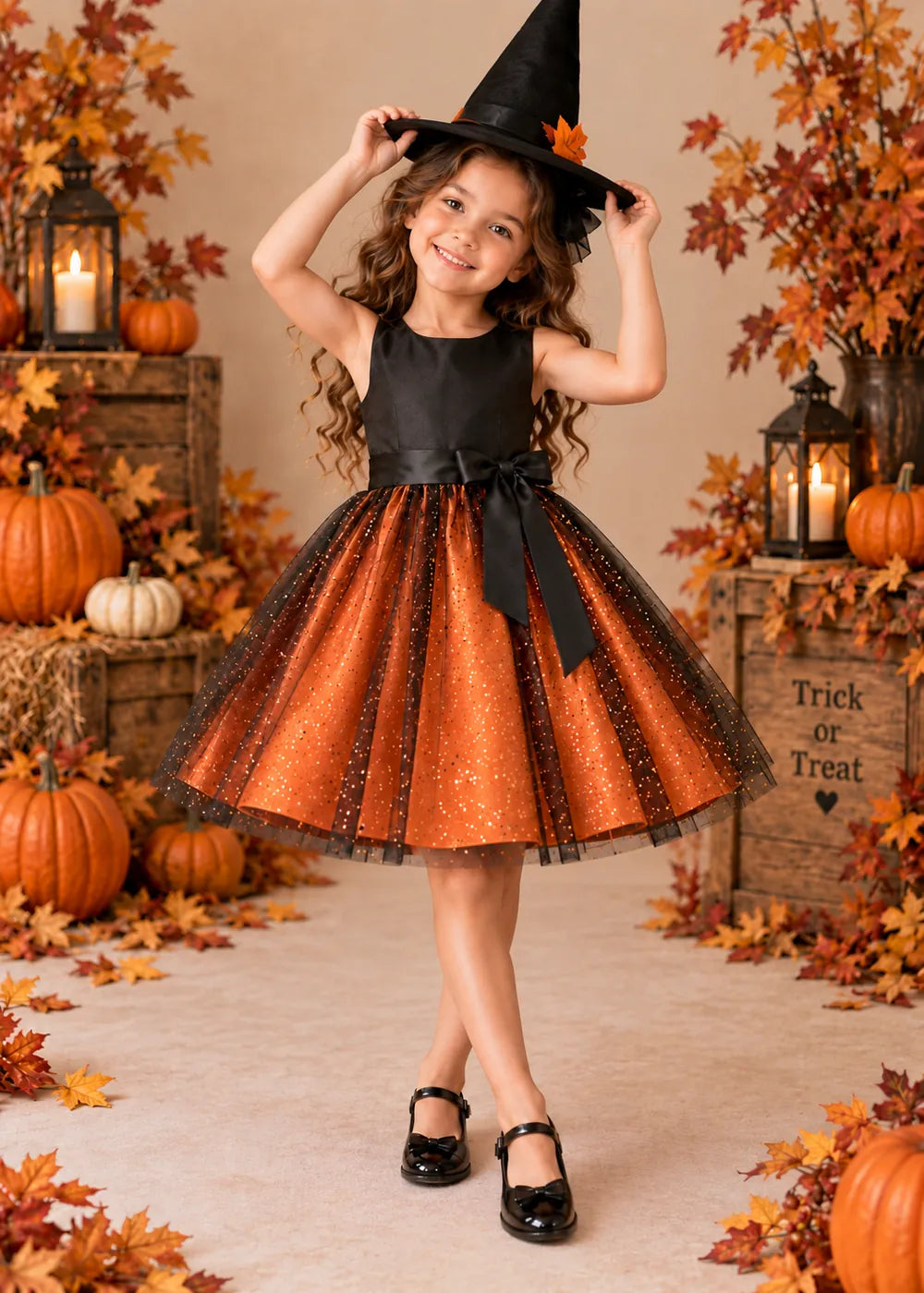 Detail view of the orange and black flower girl dress.