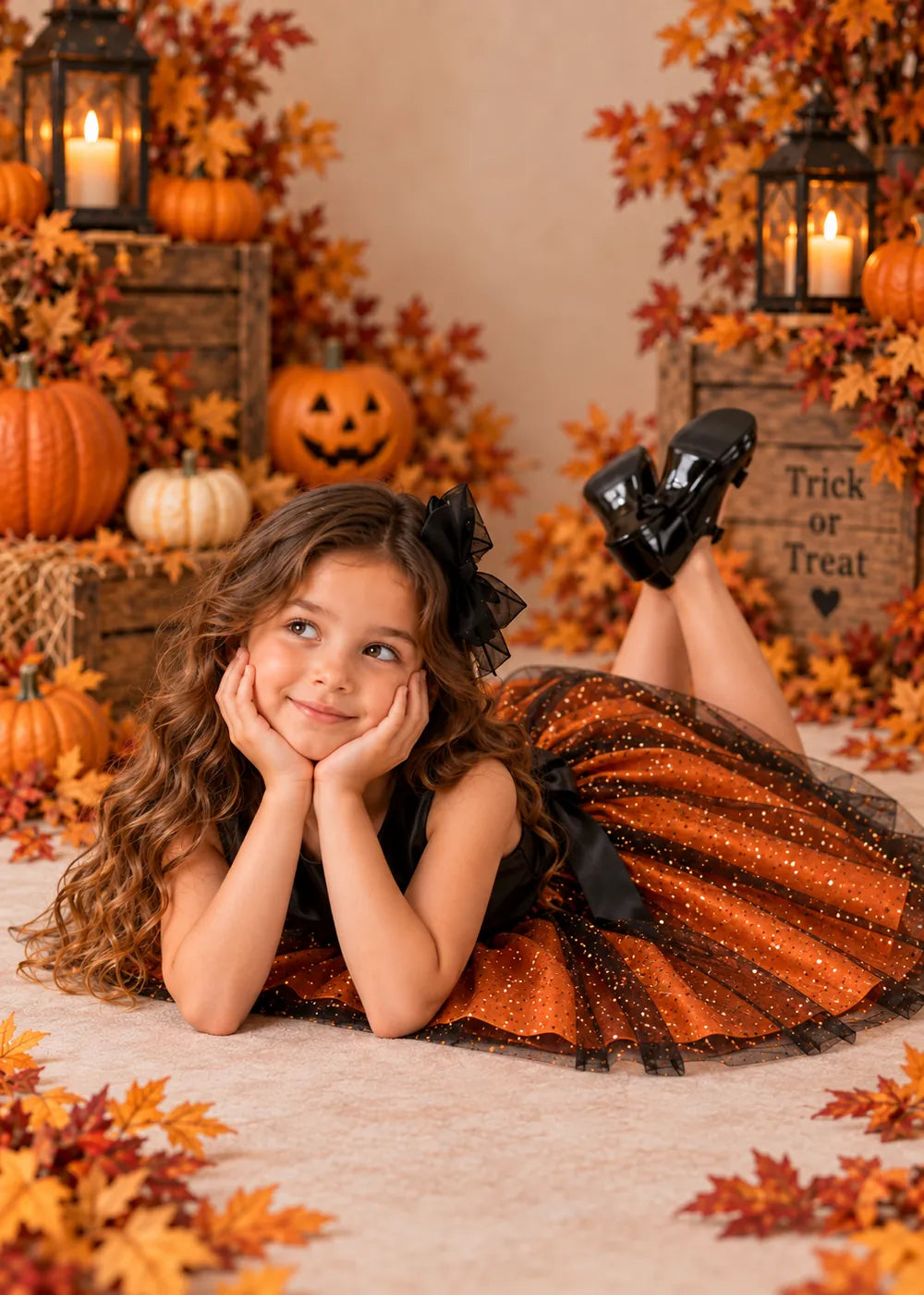 Detail view of the orange and black flower girl dress.