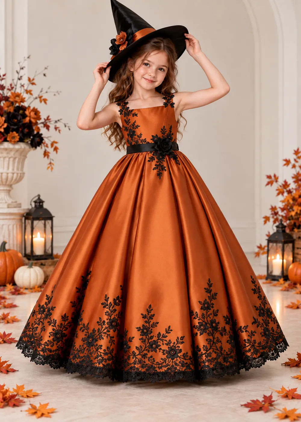 Detail view of the orange and black flower girl dress.