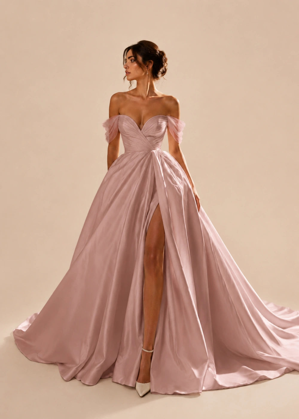 Front view of the dusty rose off-the-shoulder A-line gown with a corset bodice, high slit, and train