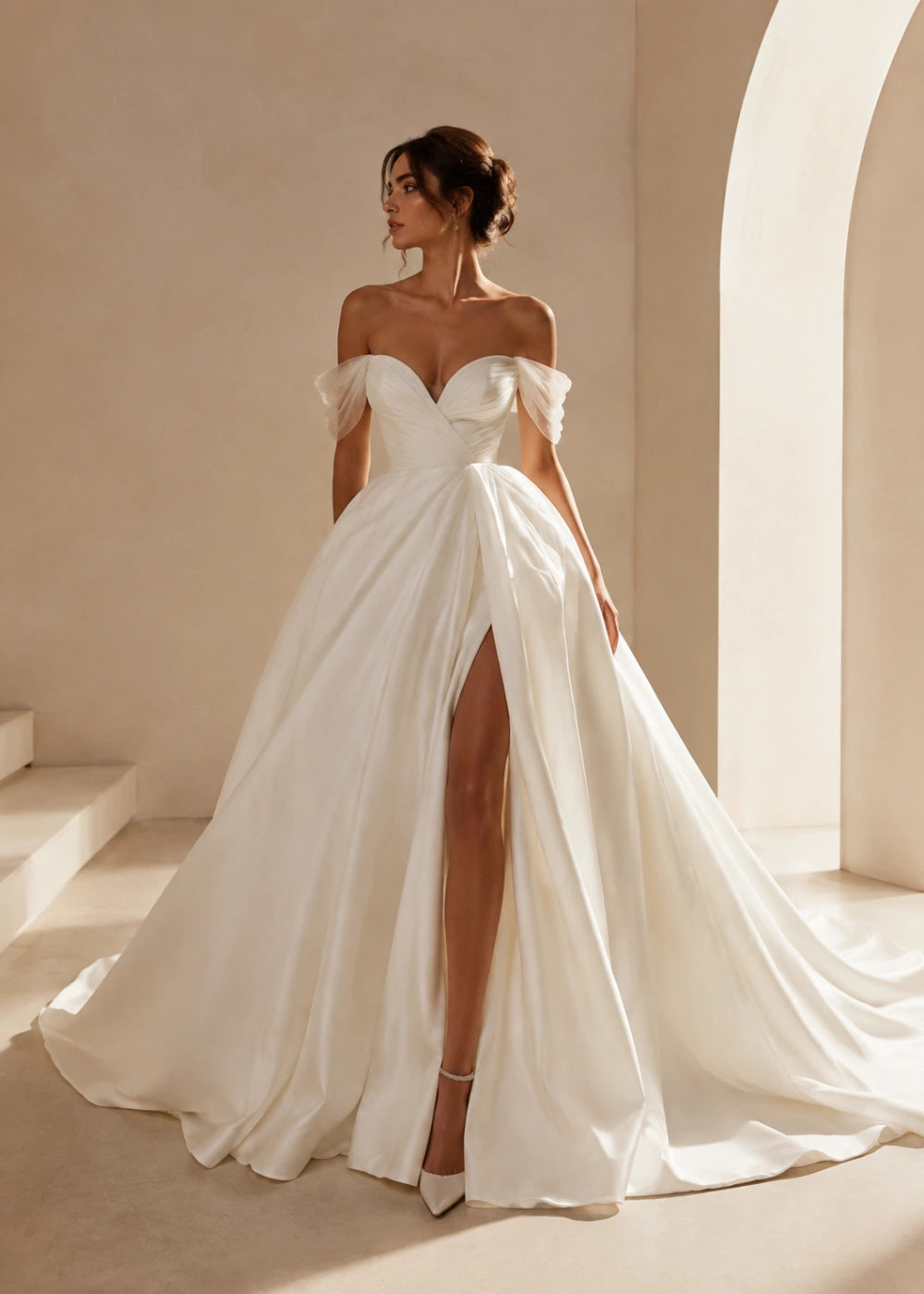 Front view of the ivory off-the-shoulder A-line gown with a corset bodice, high slit, and train