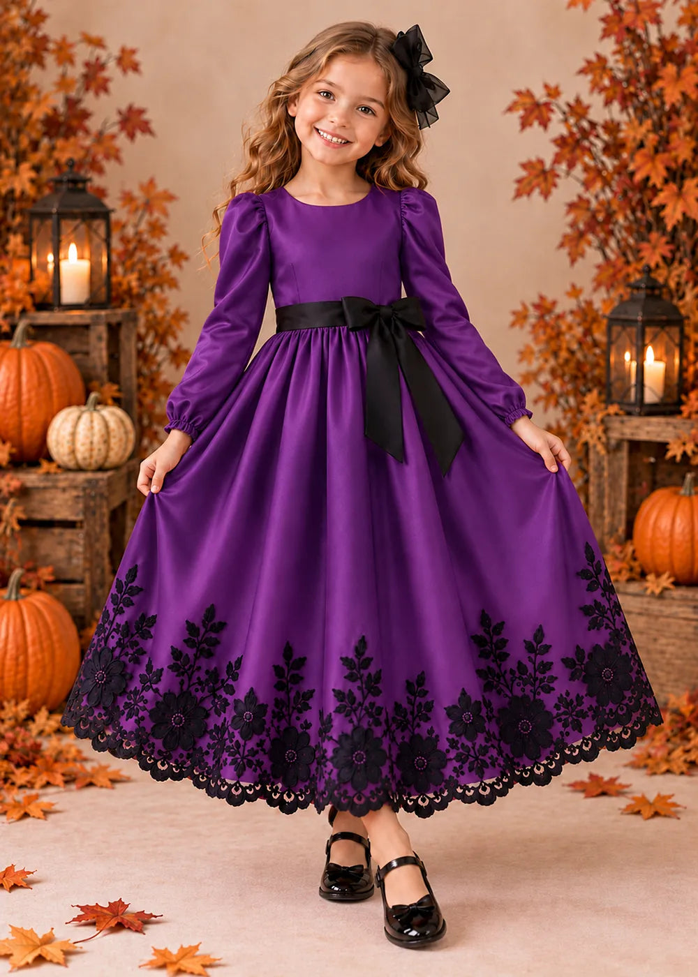 Front view of a purple long-Sleeve Flower Girl Dress with Black Floral Hem.