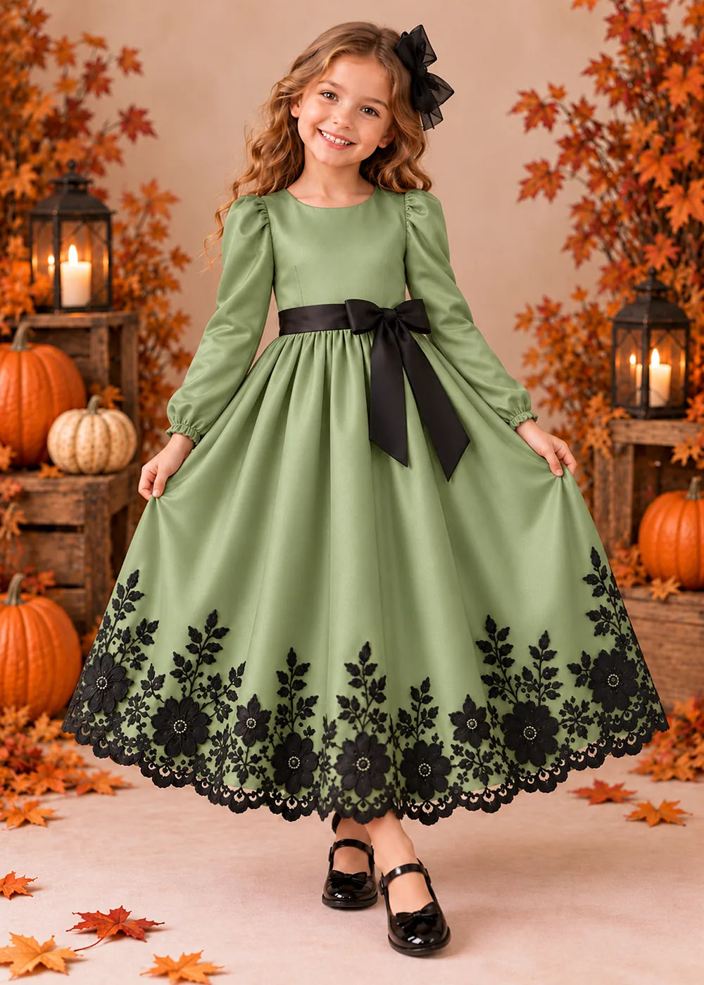 Front view of a sage green long-Sleeve Flower Girl Dress with Black Floral Hem.