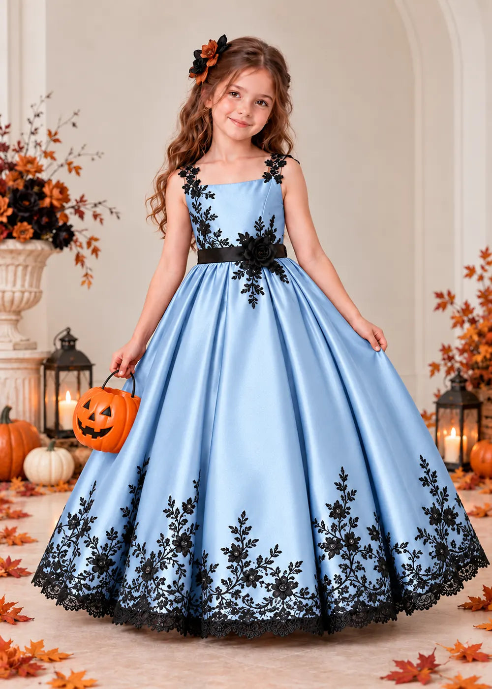Front view of a light blue flower Girl Dress with Black Floral Straps and Hem.