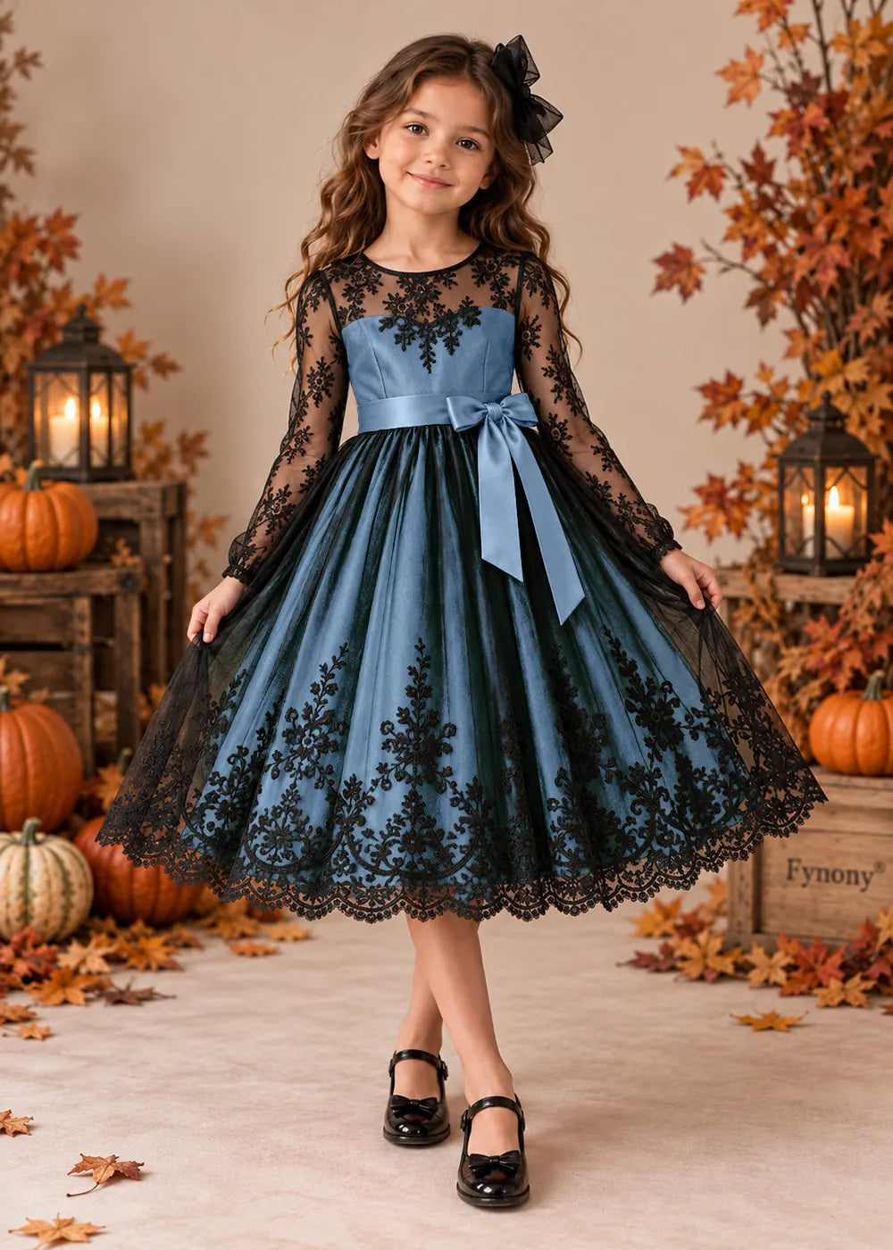 Front view of a light blue flower Girl Dress with Black Lace and Long Sleeves.