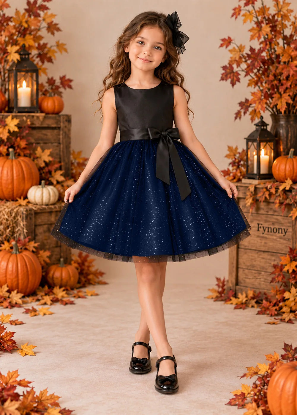 Front view of a navy blue sleeveless Flower Girl Dress with Front Bow.