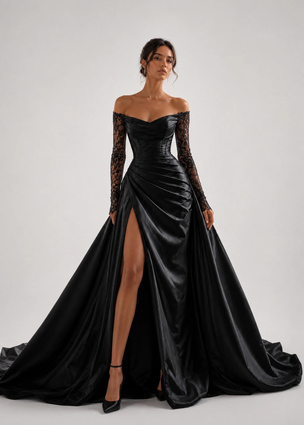 Front view of the black off-the-shoulder A-line gown with long lace sleeves and a thigh-high slit