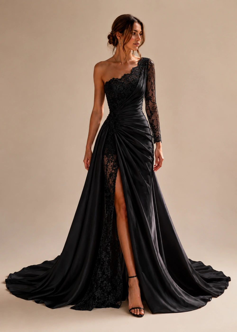 Front view of the black one-shoulder fitted gown with one long lace sleeve, a thigh-high slit, and a train