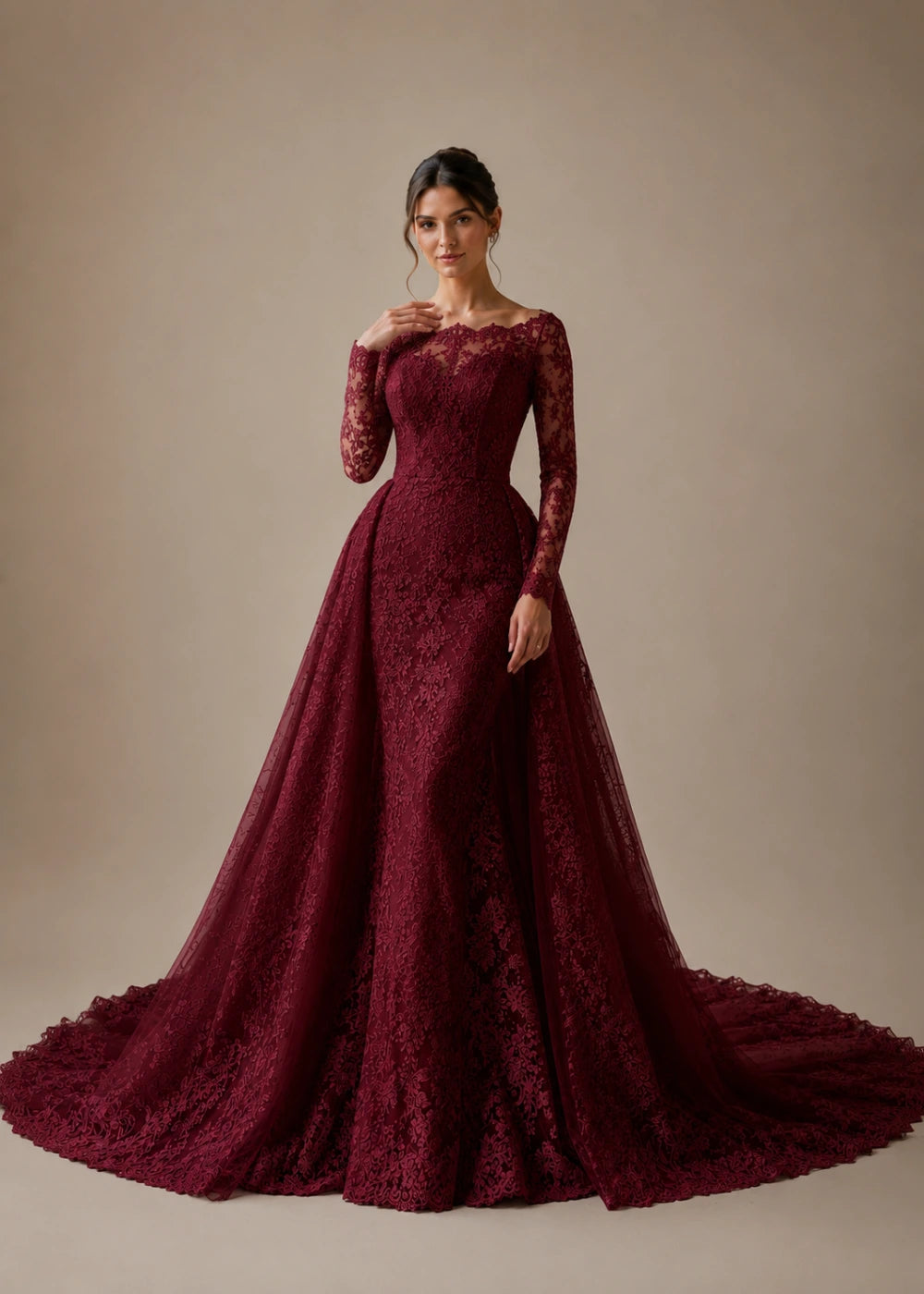 Front view of the burgundy illusion-neck A-line gown with all-over floral lace, long sleeves, and a train