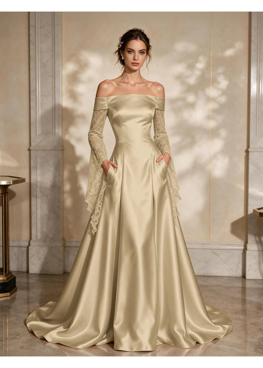 Front view of a champagne satin A-line gown with a folded off-shoulder neckline and draped lace sleeve extensions