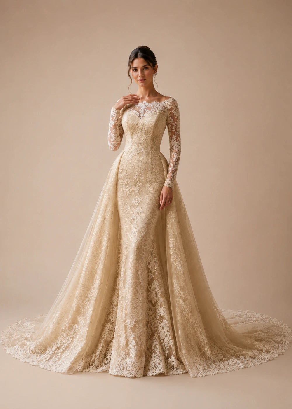 Front view of the champagne illusion-neck A-line gown with all-over floral lace, long sleeves, and a train