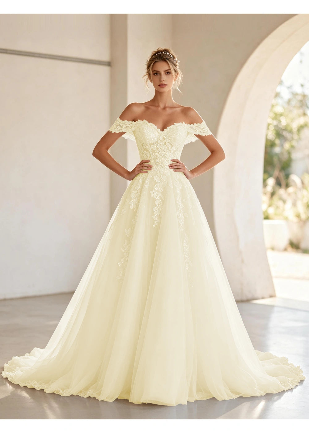 Front view of the champagne off shoulder lace tulle gown with the same bridal silhouette