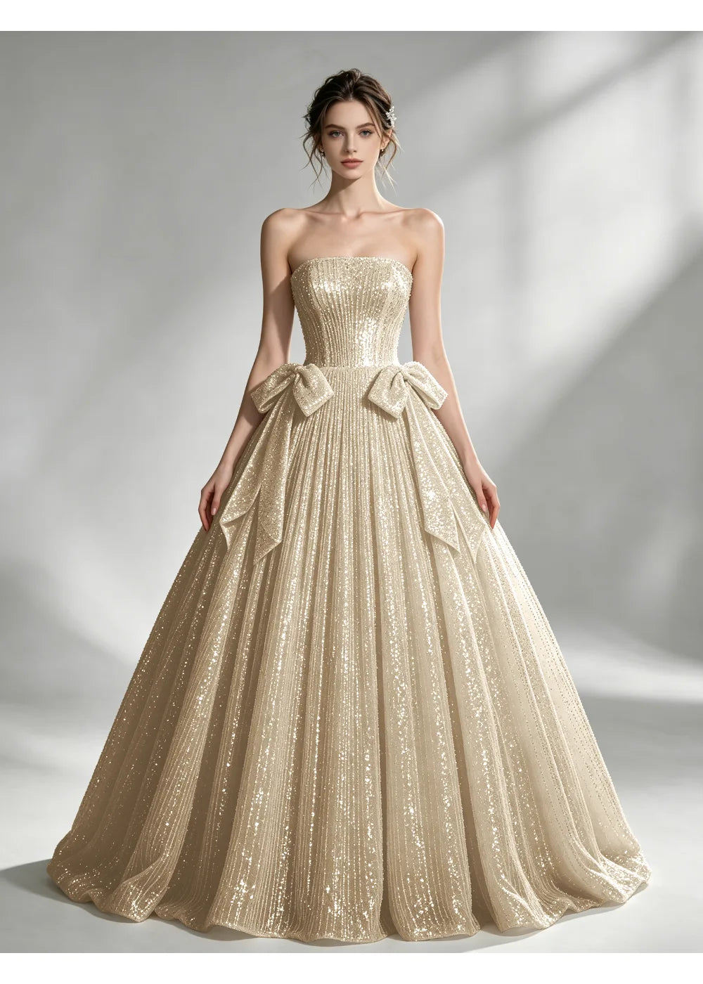 Front view of the champagne sequin twin bow gown with the same bridal silhouette