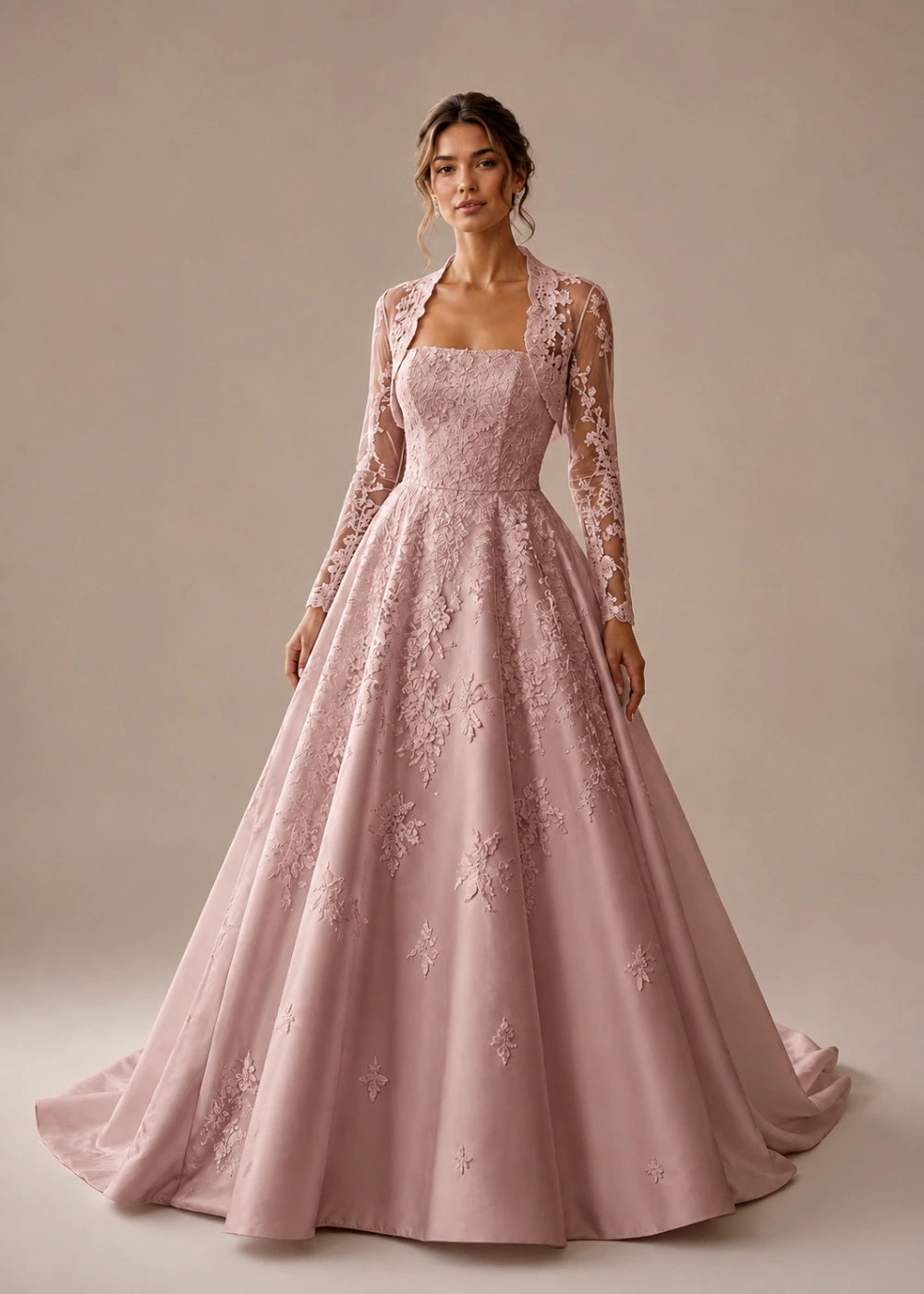 Front view of the dusty rose square-neck A-line gown with a long-sleeve lace bolero-style overlay