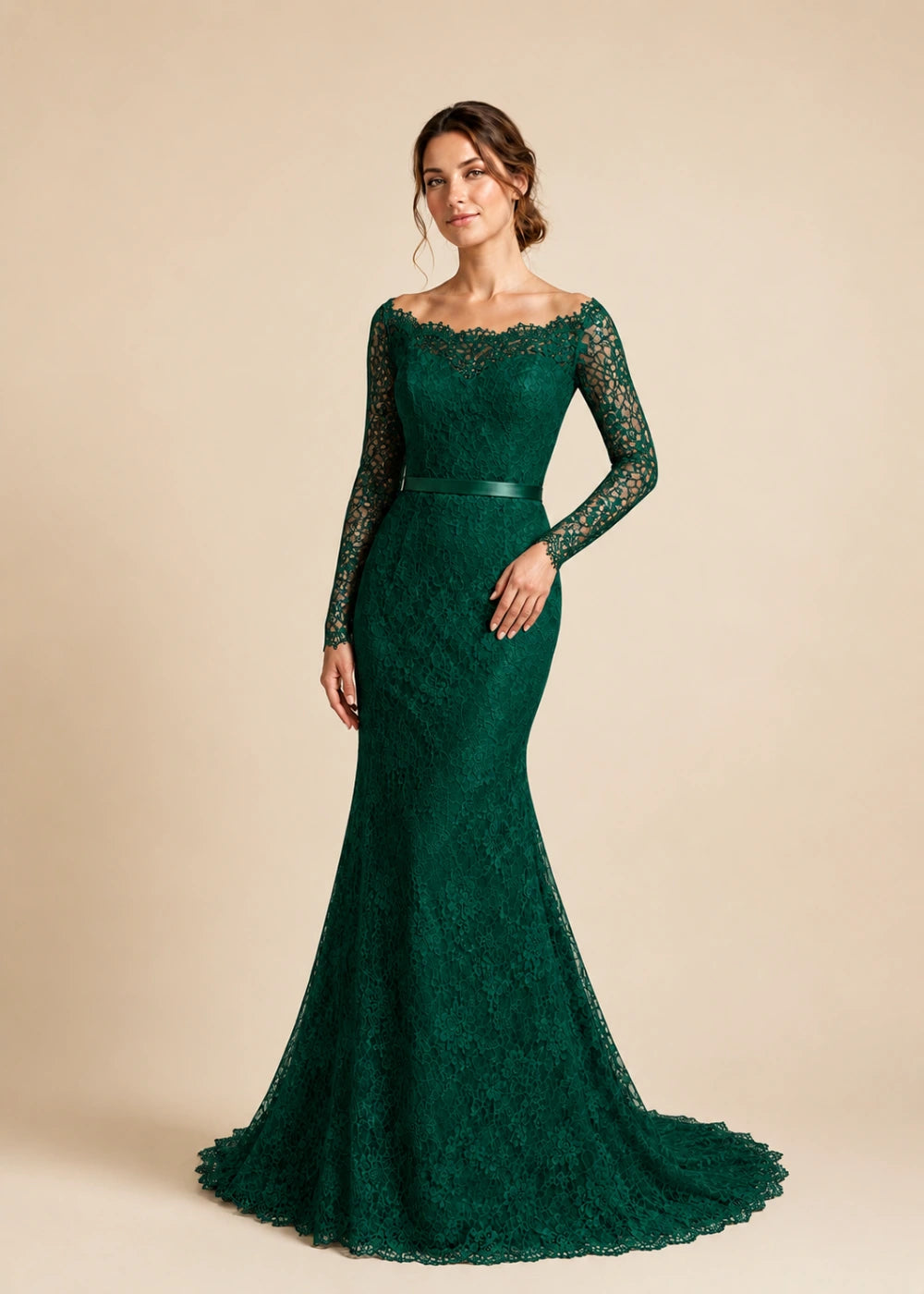 Front view of the emerald green illusion-neck mermaid gown with long floral-lace sleeves and a flared train