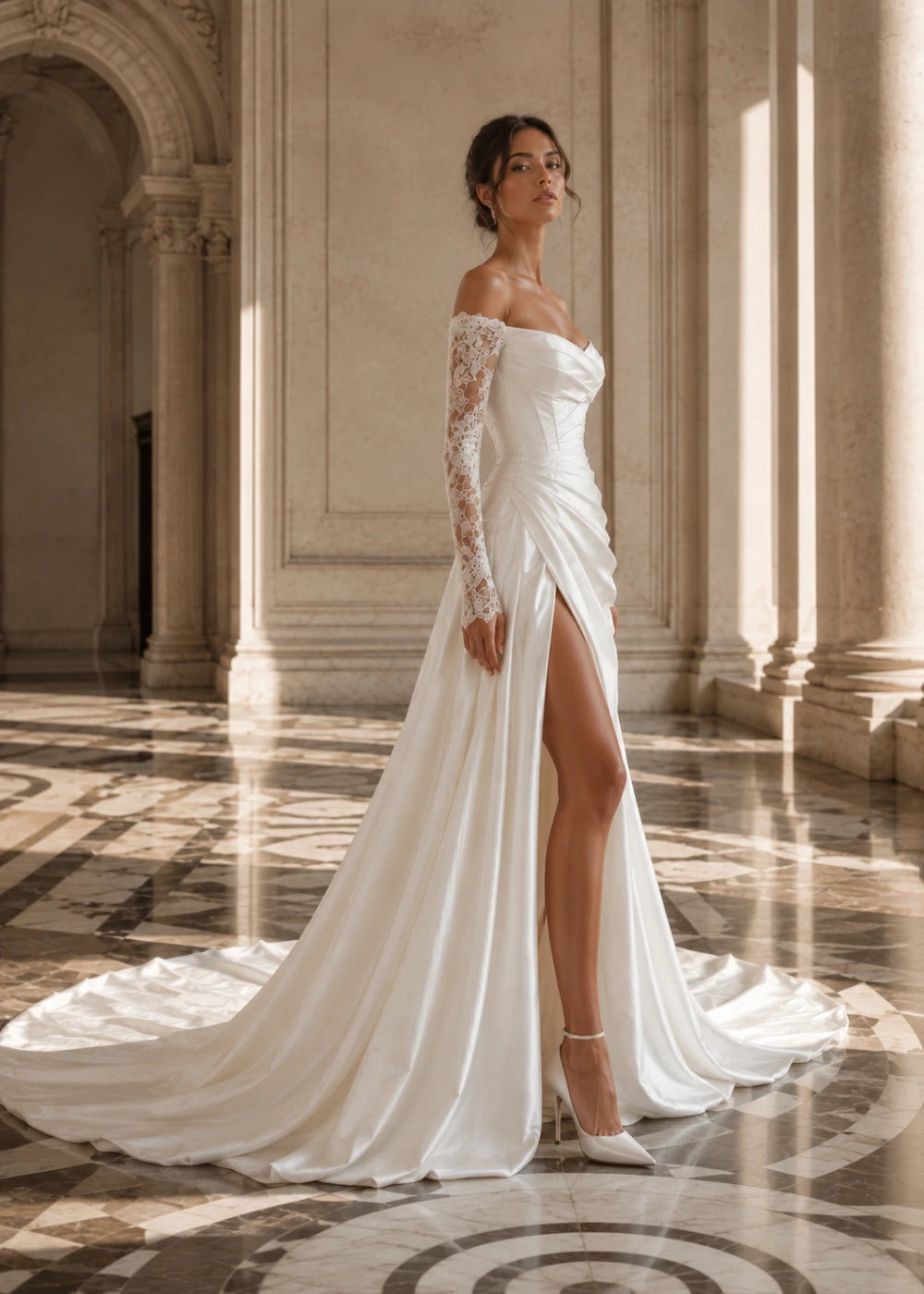 Editorial view of the ivory off-the-shoulder A-line gown with long lace sleeves and a thigh-high slit
