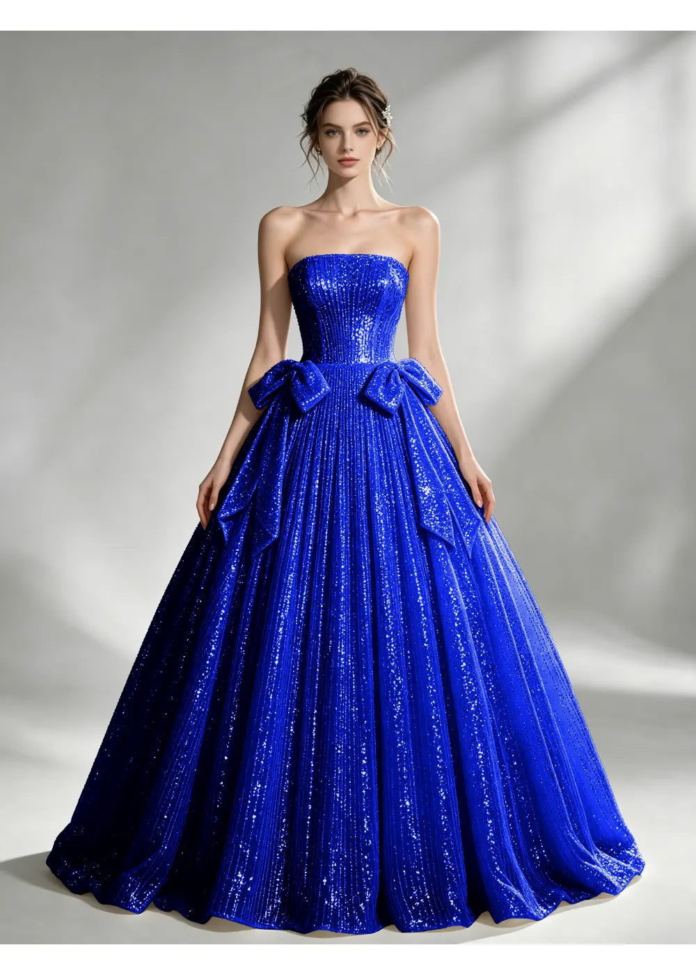 Front view of the royal blue sequin twin bow gown with the same bridal silhouette