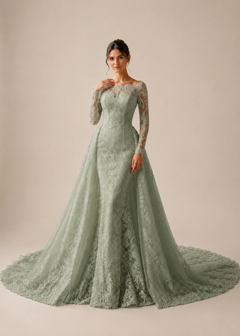 Front view of the sage green illusion-neck A-line gown with all-over floral lace, long sleeves, and a train