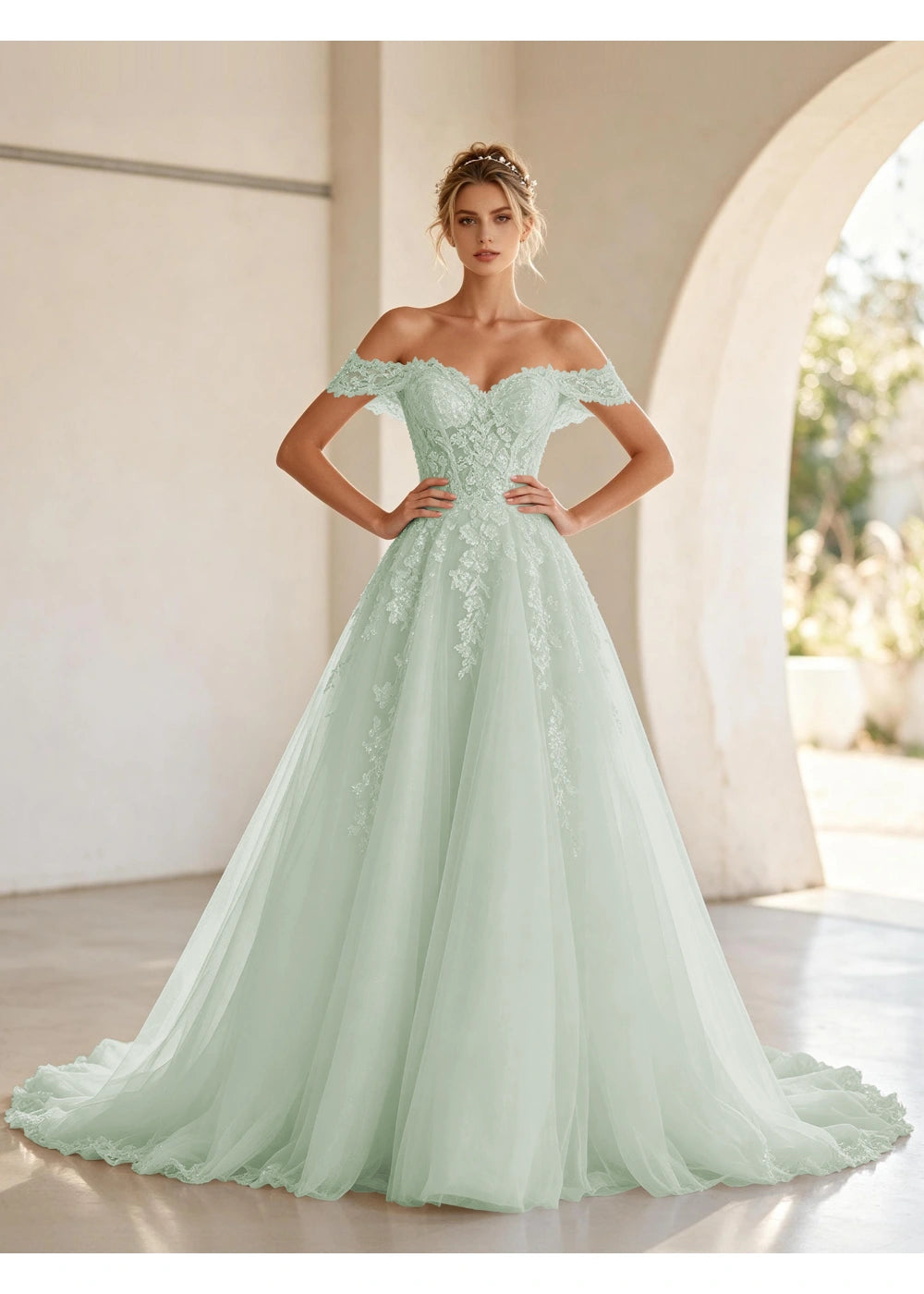 Front view of the sage green off shoulder lace tulle gown with the same bridal silhouette