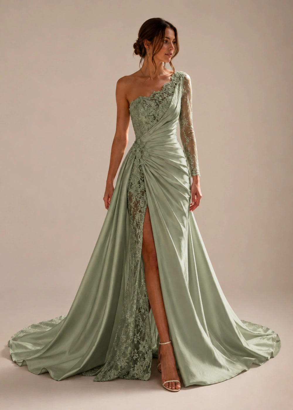 Front view of the sage green one-shoulder fitted gown with one long lace sleeve, a thigh-high slit, and a train