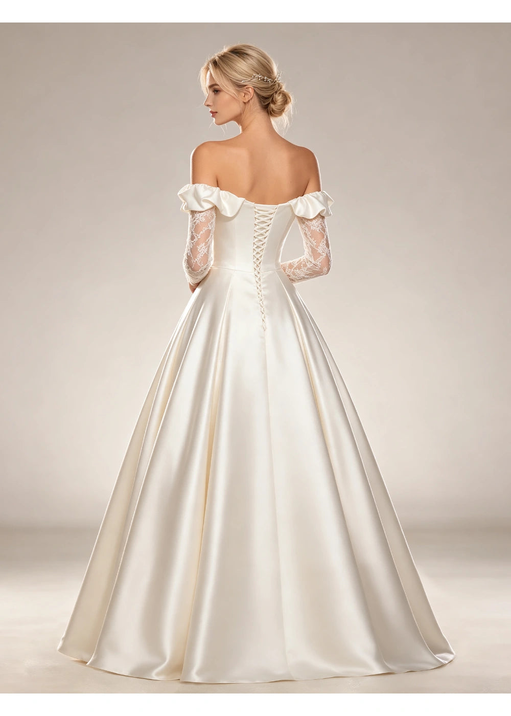 Back view of the white satin gown showing the folded shoulder band, center fastening and full skirt