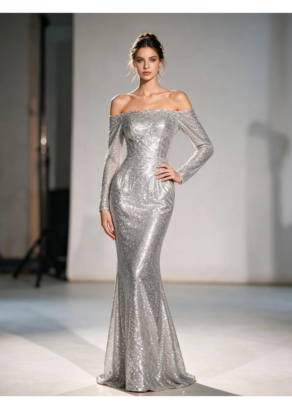 Full-length front view of the silver sequin surface and flared lower hem