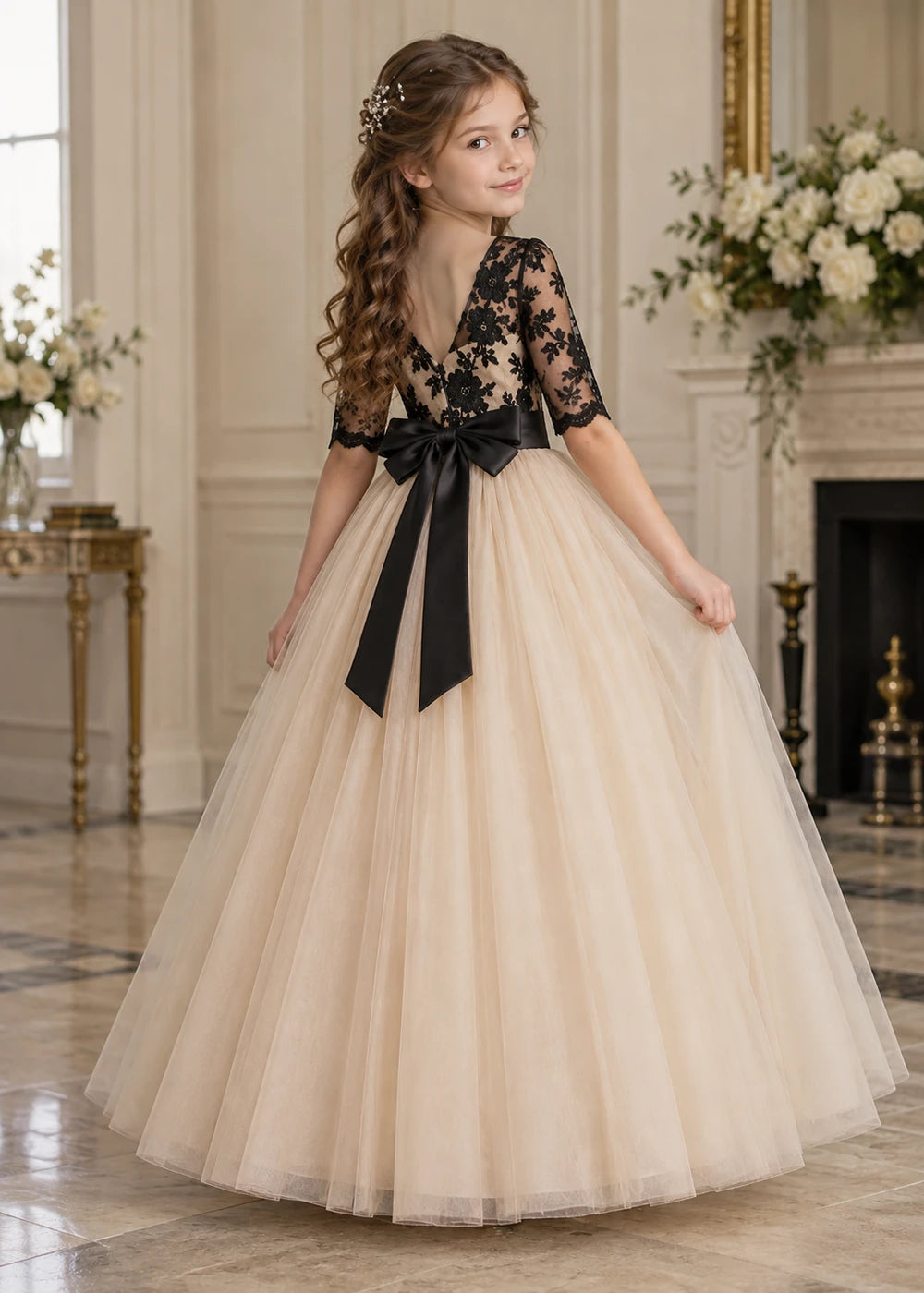 Side back view of the beige and black flower girl dress.