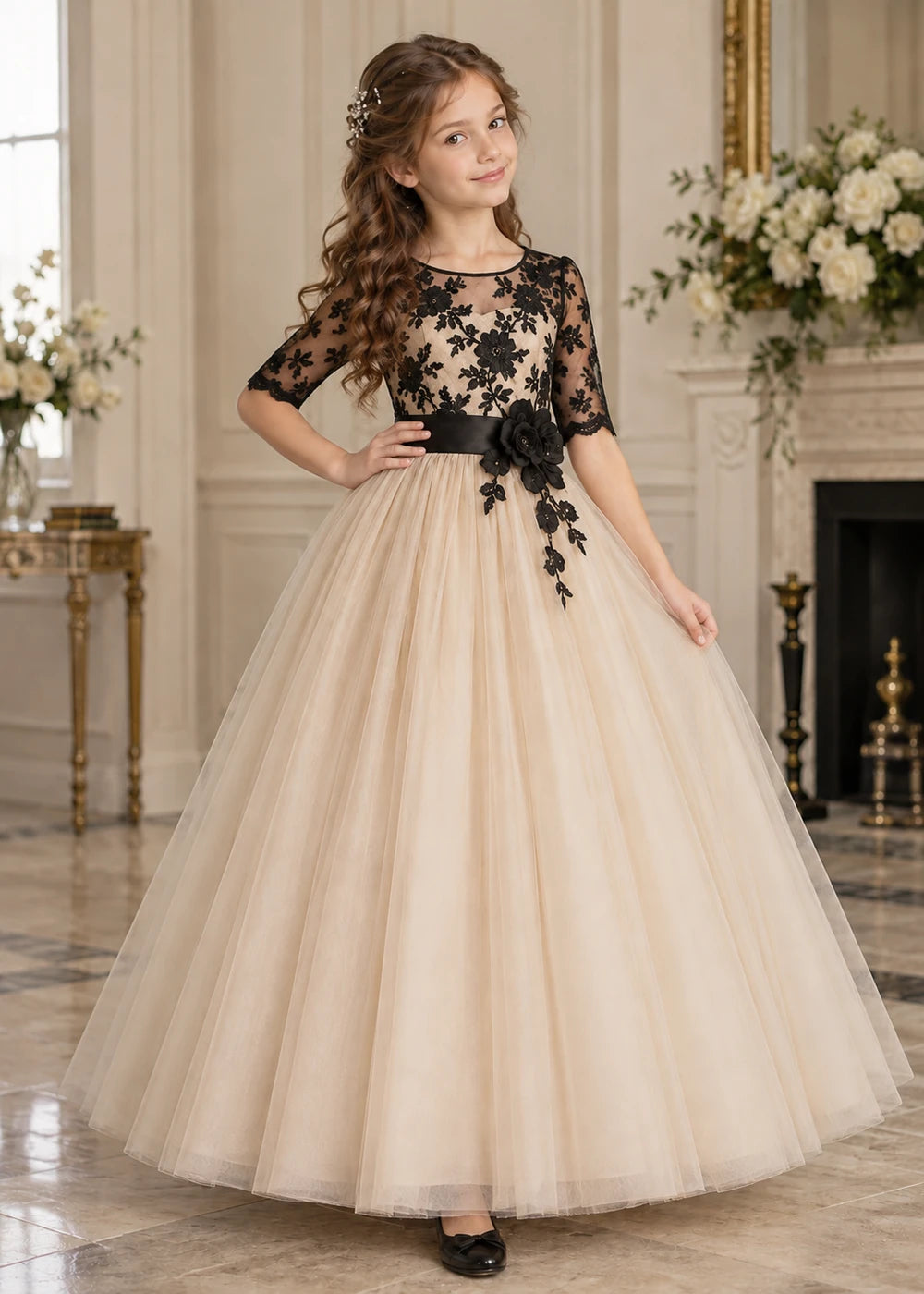 Detail view of the beige and black flower girl dress.