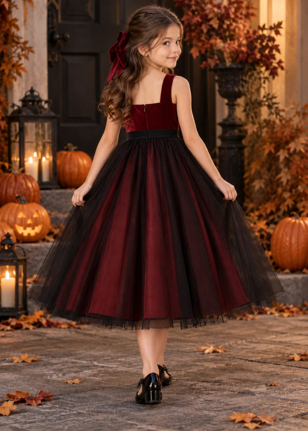 Back view of the burgundy and black flower girl dress.