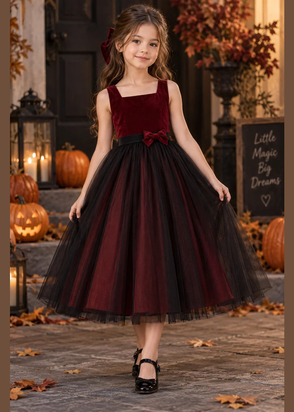 Front view of the burgundy and black flower girl dress.
