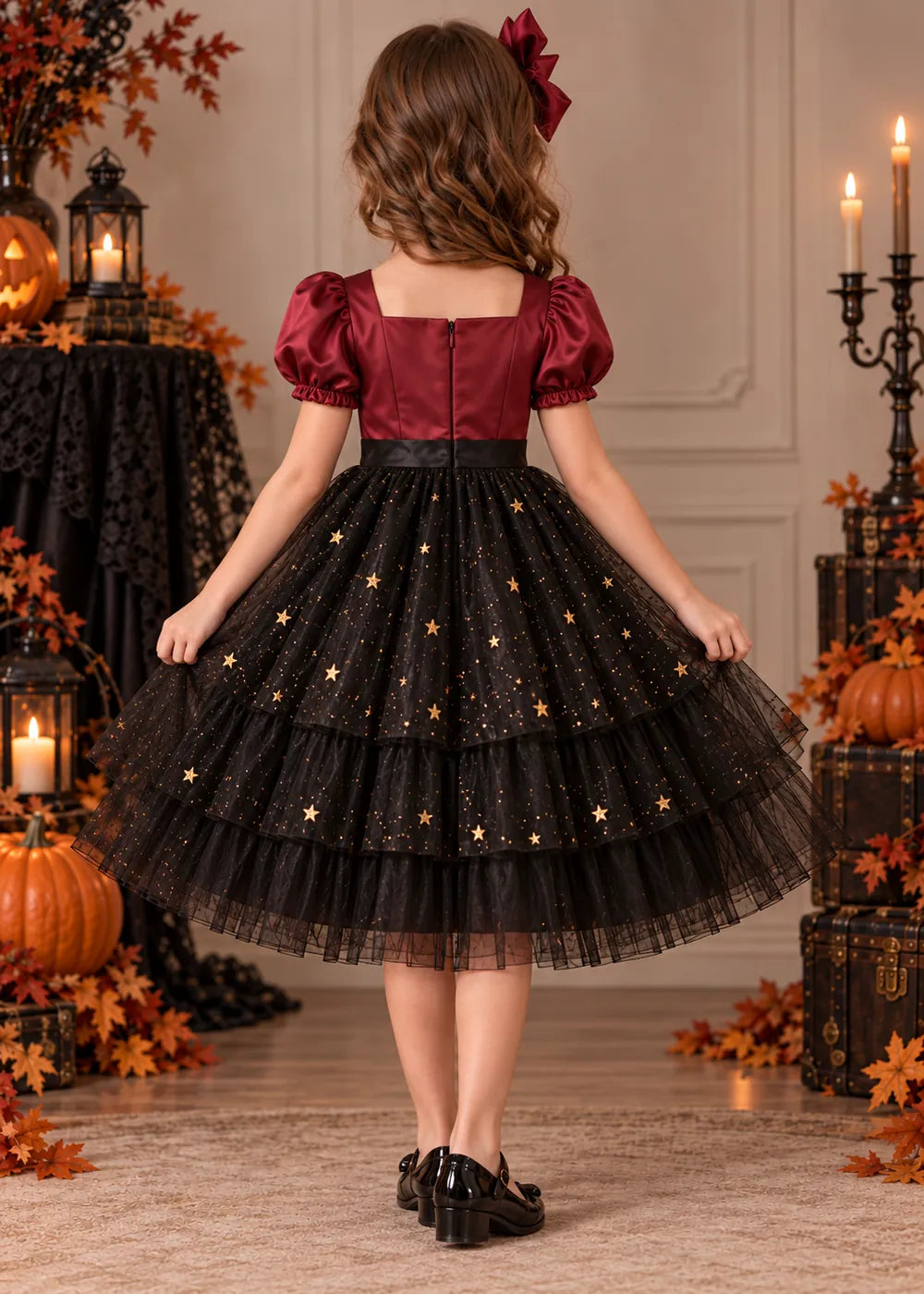 Back view of the burgundy and black flower girl dress.