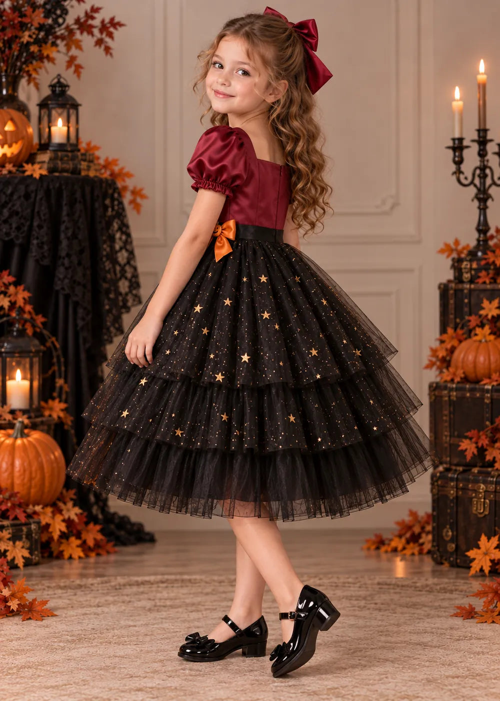 Detail view of the burgundy and black flower girl dress.