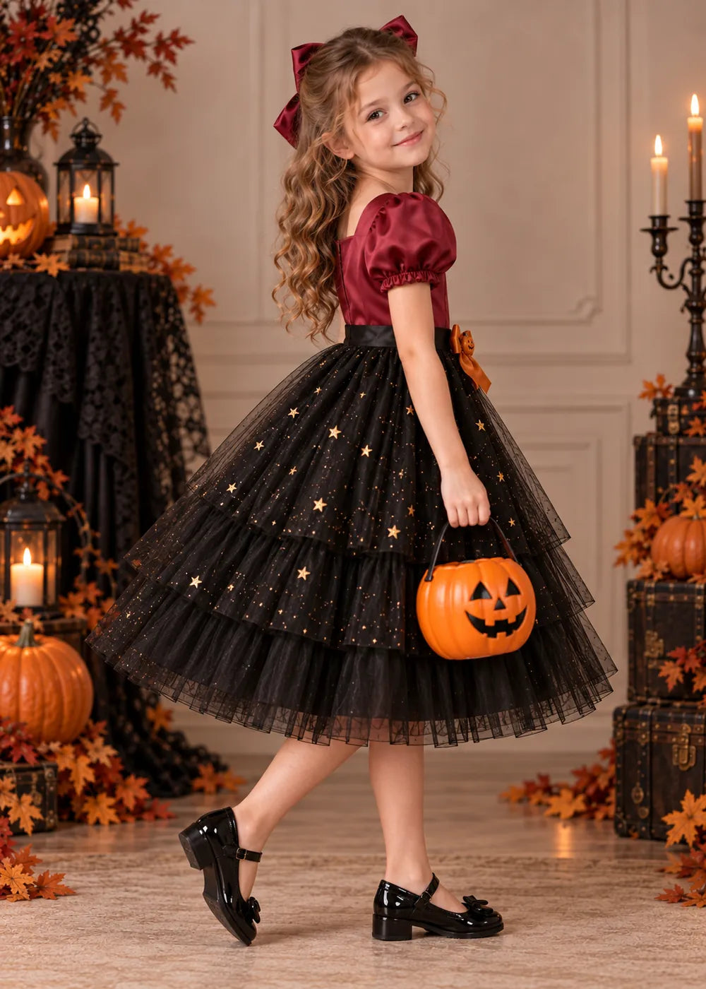 Detail view of the burgundy and black flower girl dress.