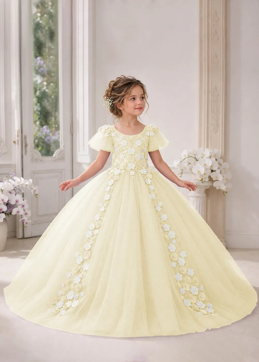 Front view of a child wearing a champagne flower girl dress with a round neckline, sheer flutter cap sleeves and a floral vine cascading down both sides of a full tulle skirt.