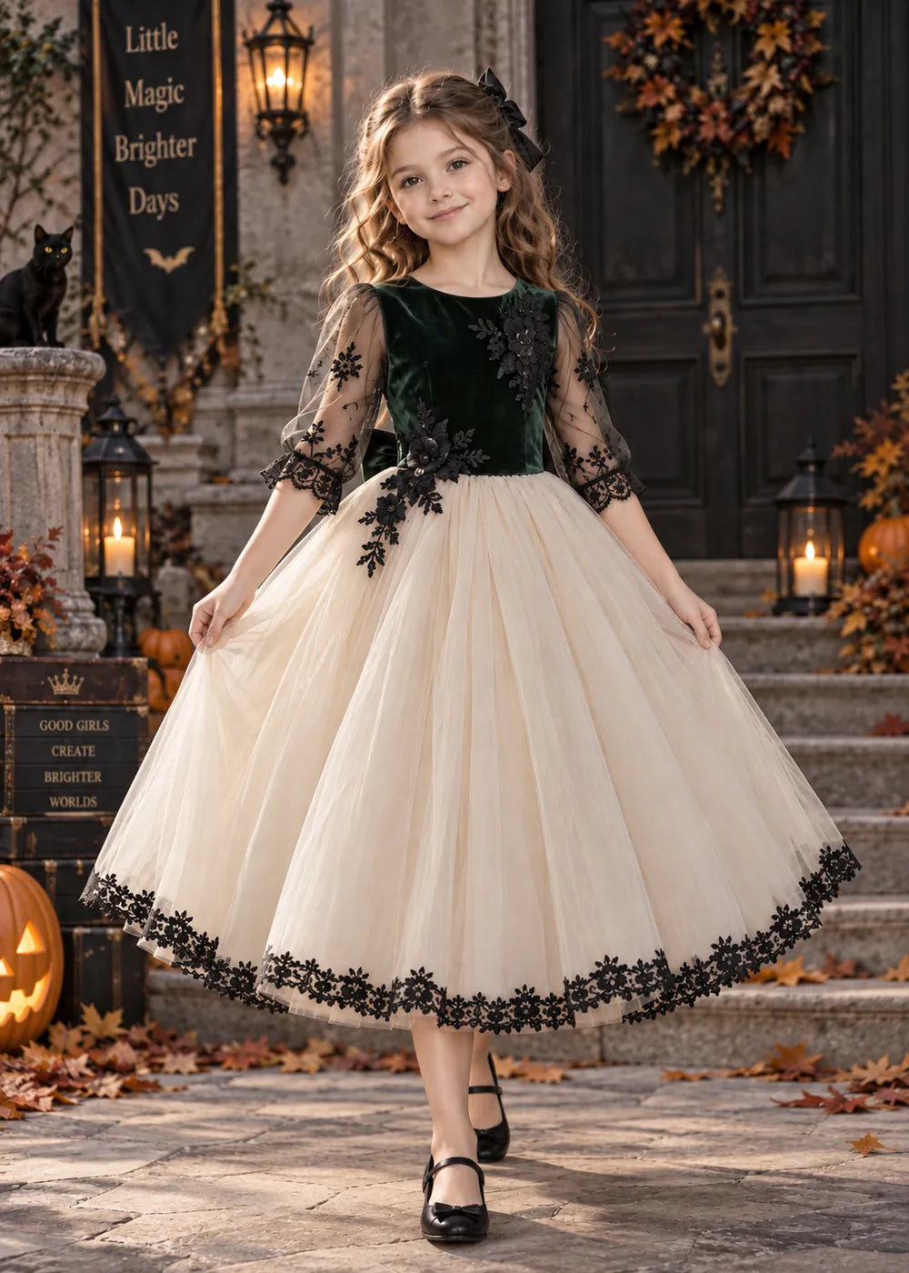 Detail view of the dark green, cream, and black flower girl dress.