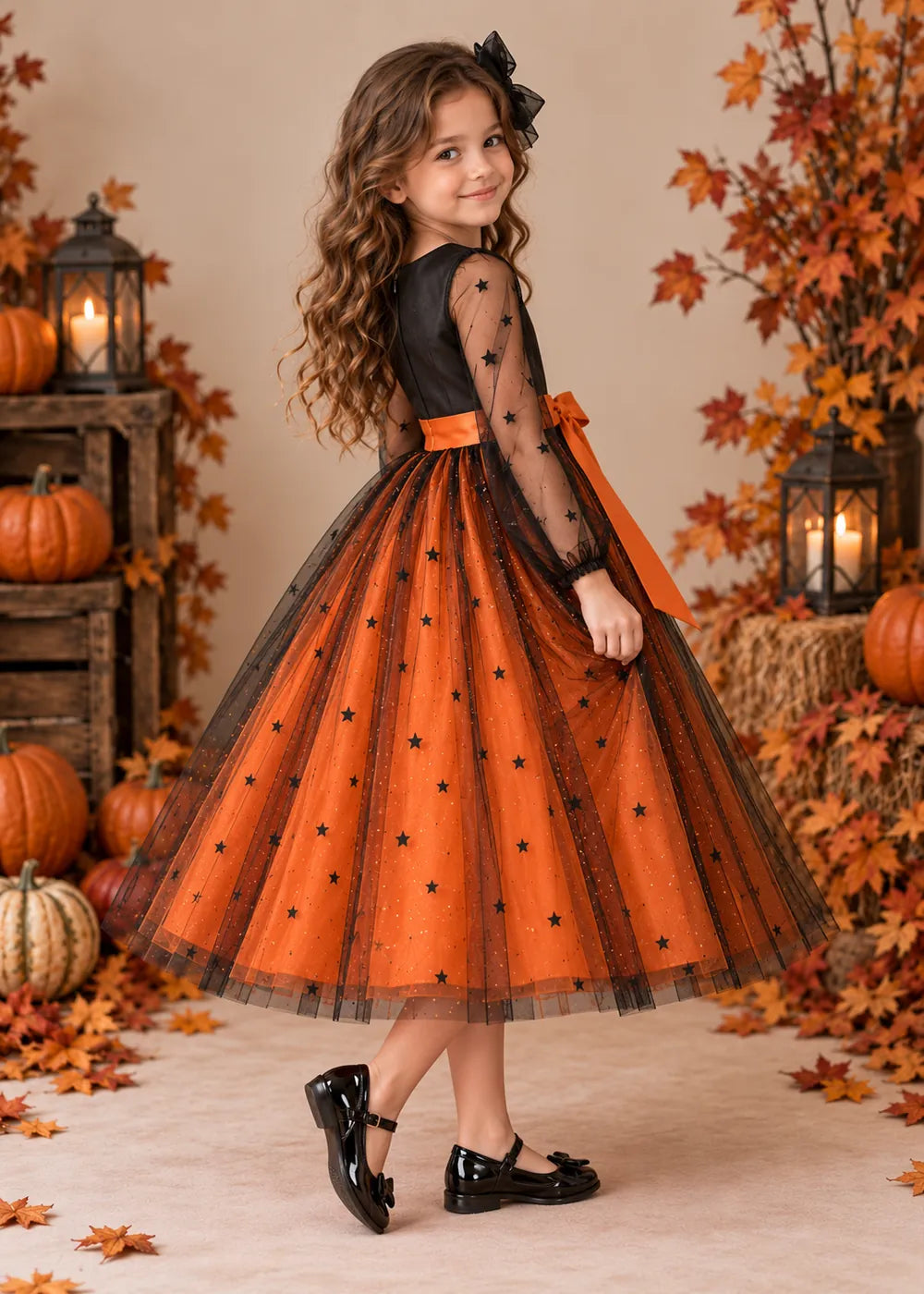 Detail view of the orange and black flower girl dress.
