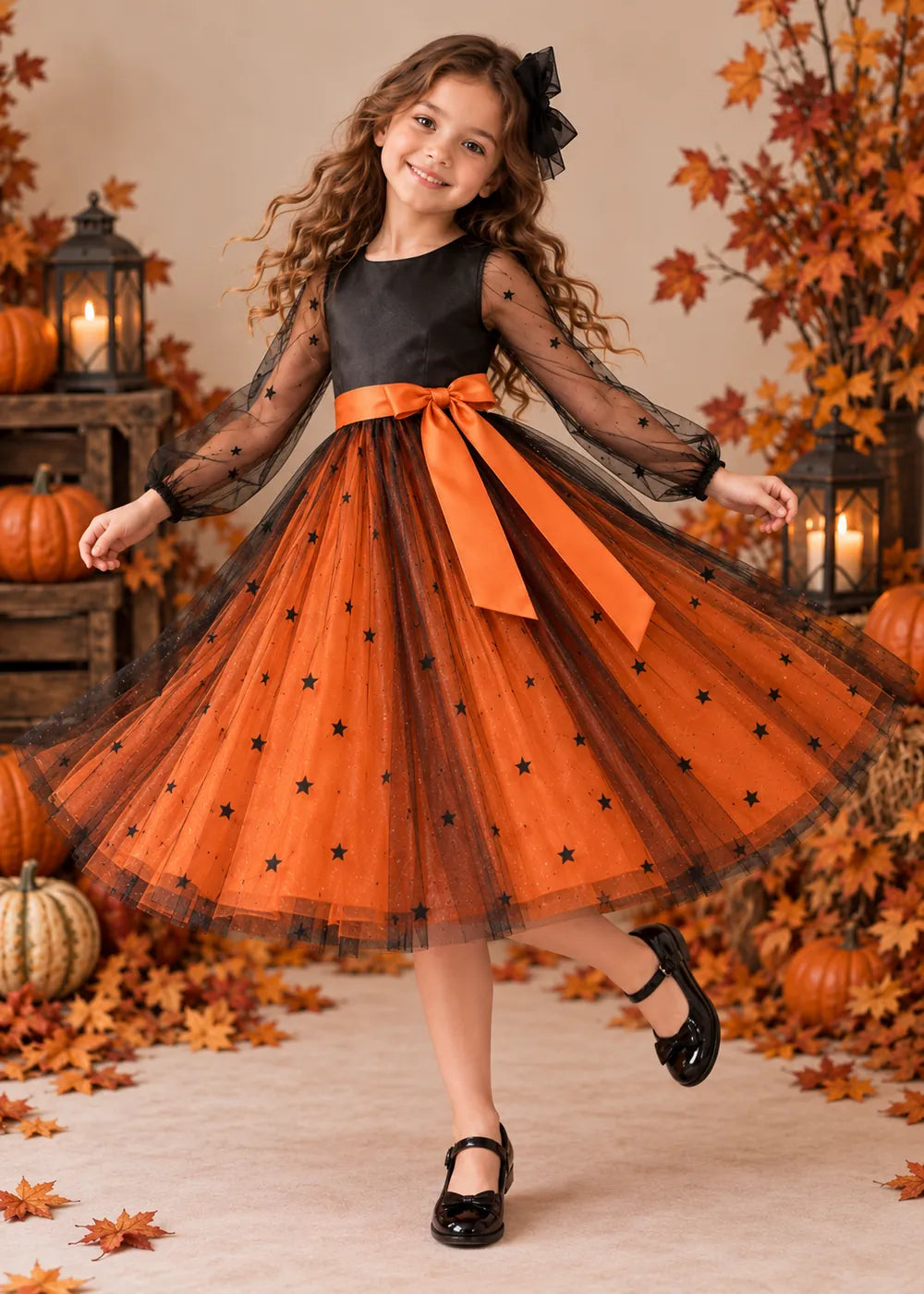 Detail view of the orange and black flower girl dress.