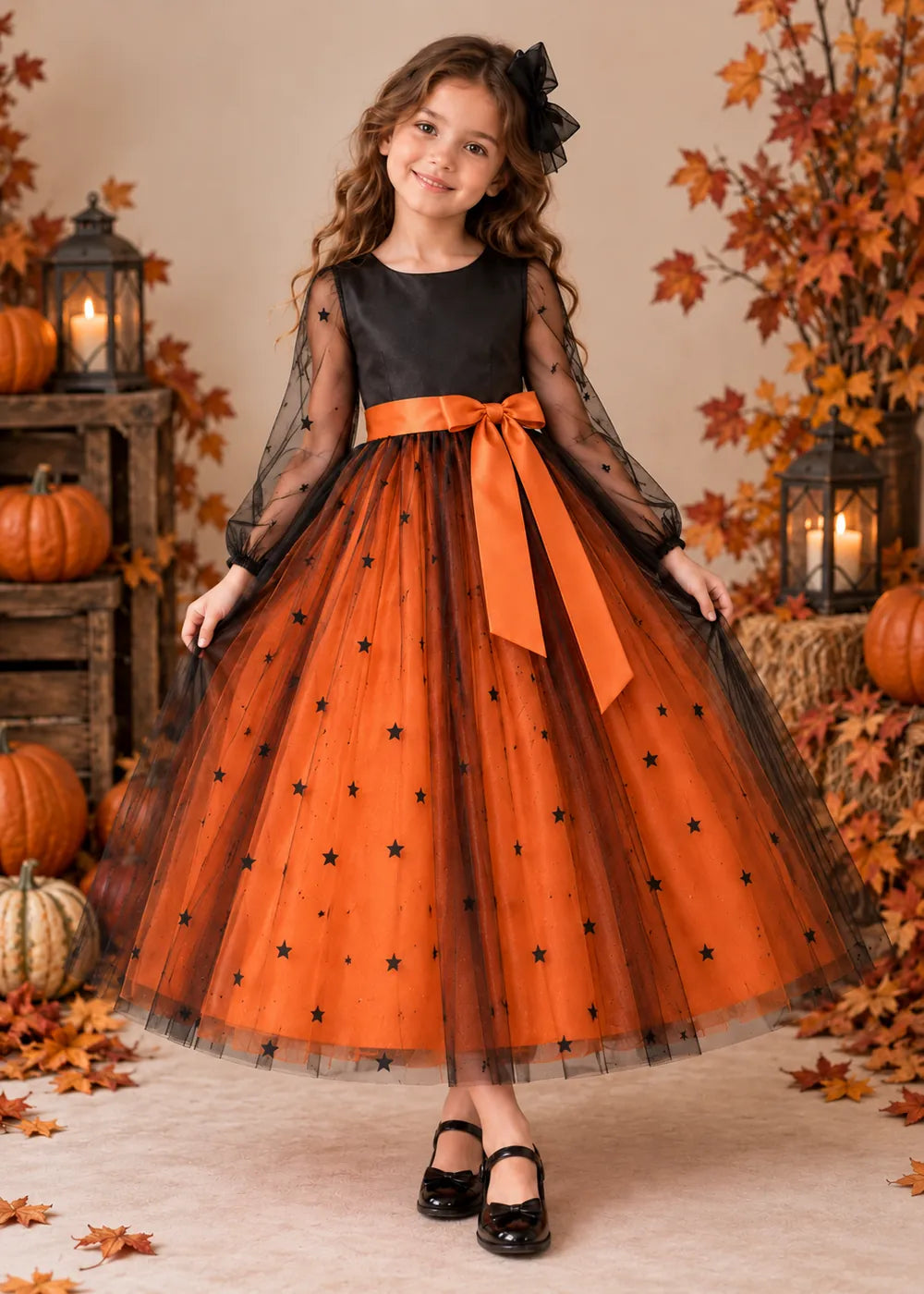 Front view of the orange and black flower girl dress.